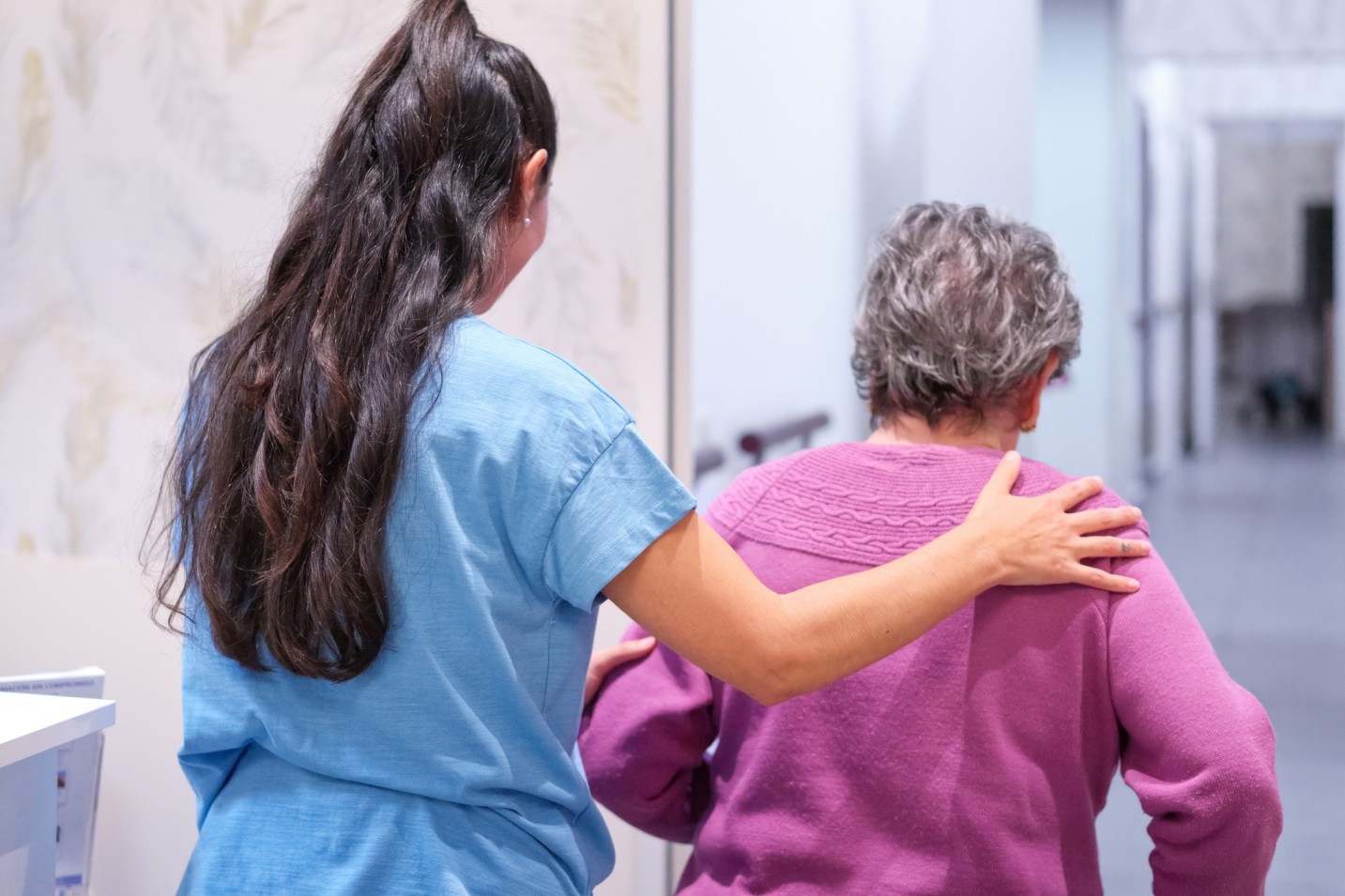 medical aide assisting patient.