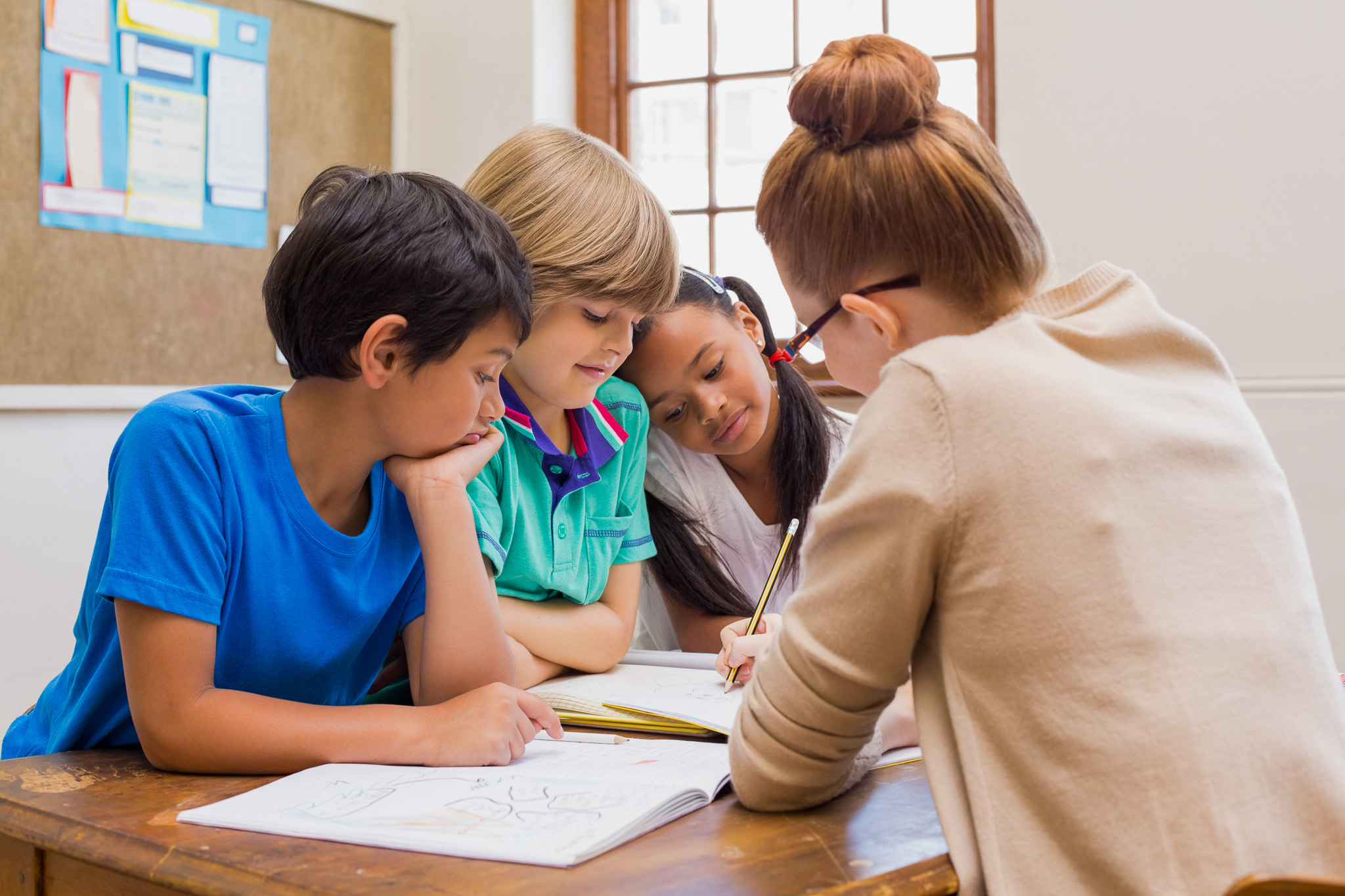 three children learning at school.