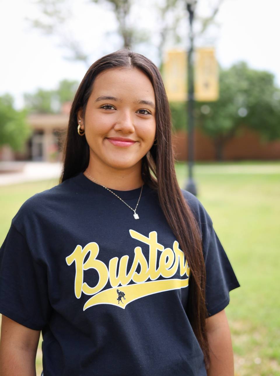 portrait of sga student standing in campus